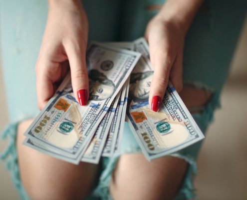 Woman Holding Money